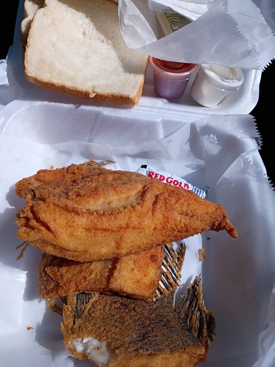 Restaurant menu listing fried seafood plates and side orders.