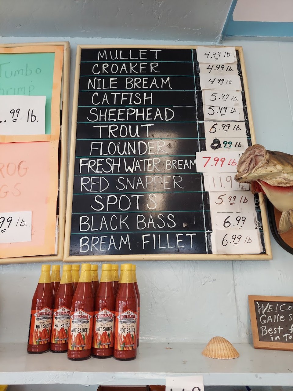 Printed menu featuring shrimp, catfish, and tilapia.