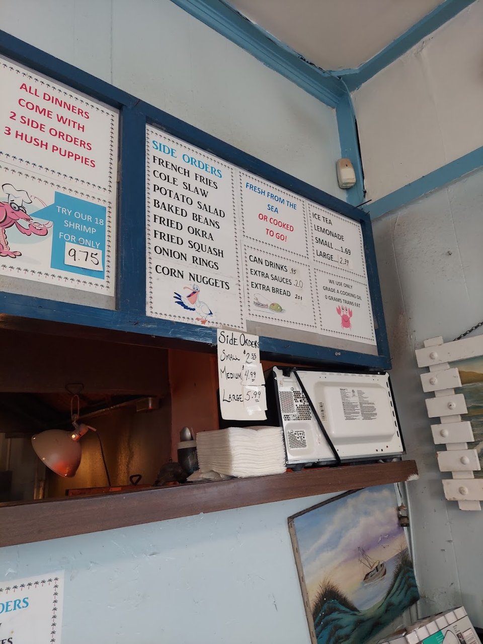 Restaurant menu listing fried seafood plates and side orders.